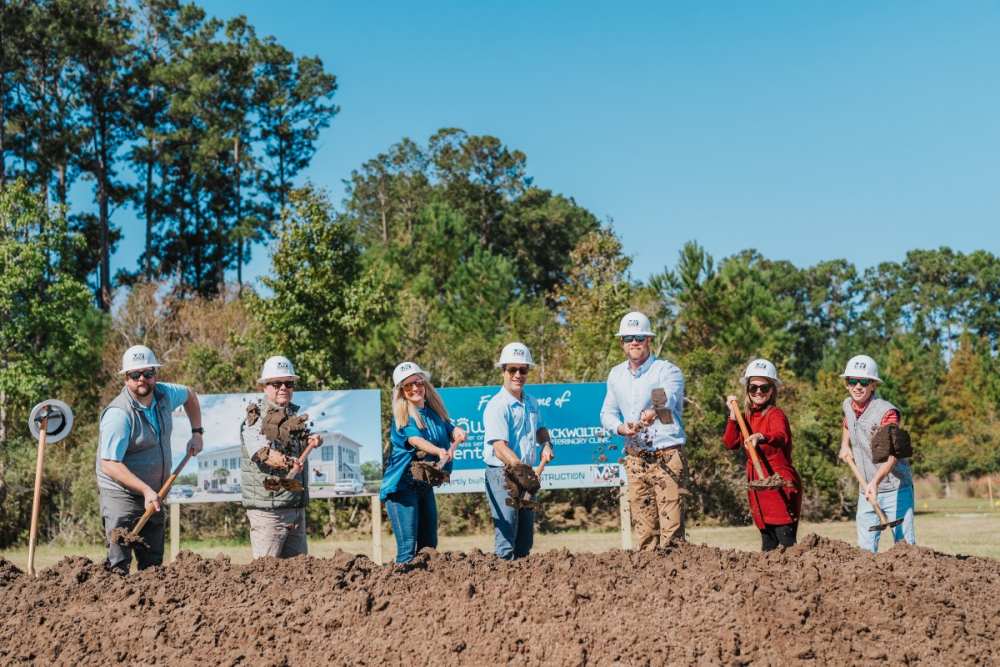 May Construction Team at groundbreaking with shovels